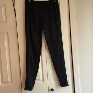 Adidas jogger pants. In the color black and a size small.